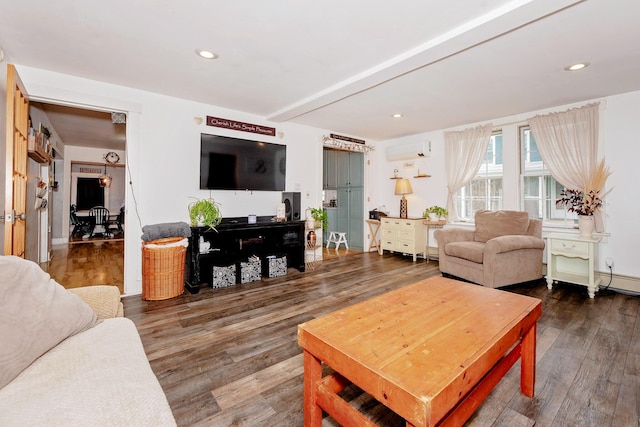 22 Pleasant St, Phillips, ME 04966 - living room with a wall unit AC, wood finished floors, and recessed lighting