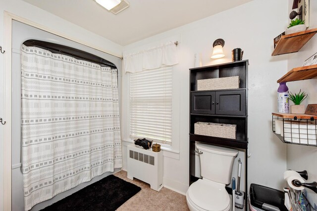 22 Pleasant St, Phillips, ME 04966 - full bathroom with radiator heating unit, toilet, a shower with shower curtain, and baseboards