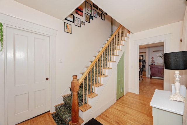 22 Pleasant St, Phillips, ME 04966 - staircase featuring wood finished floors and baseboards