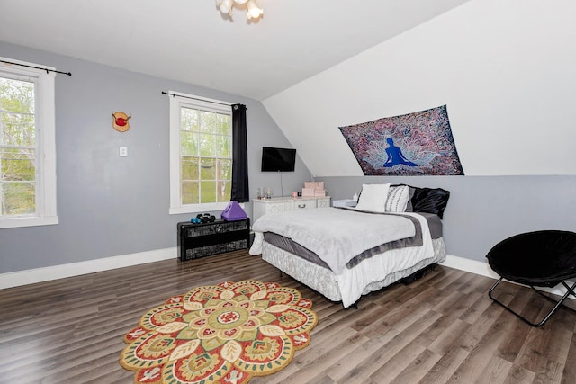 22 Pleasant St, Phillips, ME 04966 - bedroom with lofted ceiling, wood finished floors, and baseboards