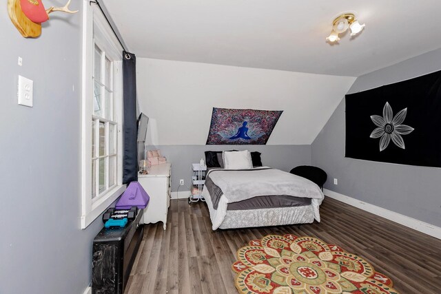 22 Pleasant St, Phillips, ME 04966 - bedroom with wood finished floors, lofted ceiling, and baseboards