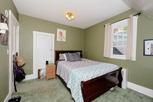 22 Pleasant St, Phillips, ME 04966 - carpeted bedroom featuring baseboards and vaulted ceiling
