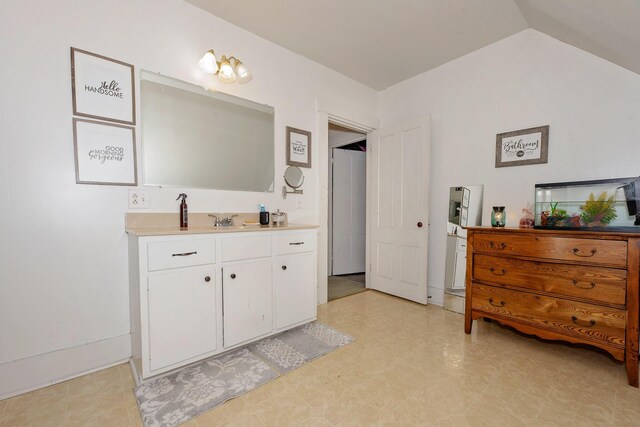 22 Pleasant St, Phillips, ME 04966 - bathroom featuring vanity, tile patterned floors, and lofted ceiling