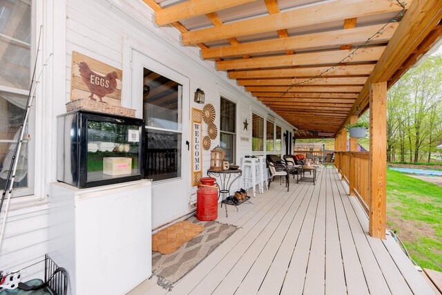 22 Pleasant St, Phillips, ME 04966 - wooden deck with a porch