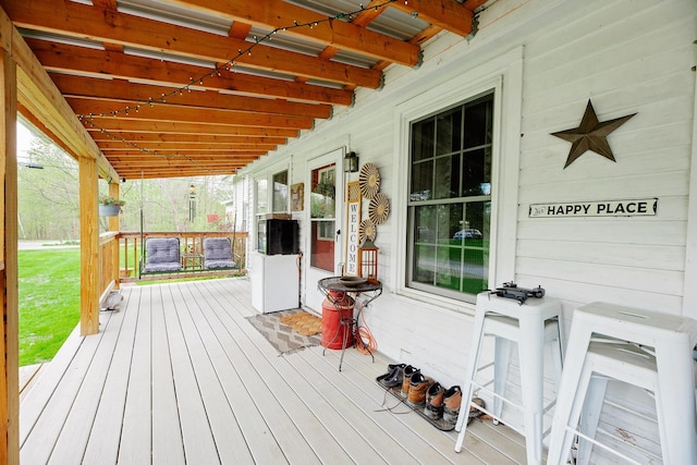 22 Pleasant St, Phillips, ME 04966 - wooden terrace featuring covered porch