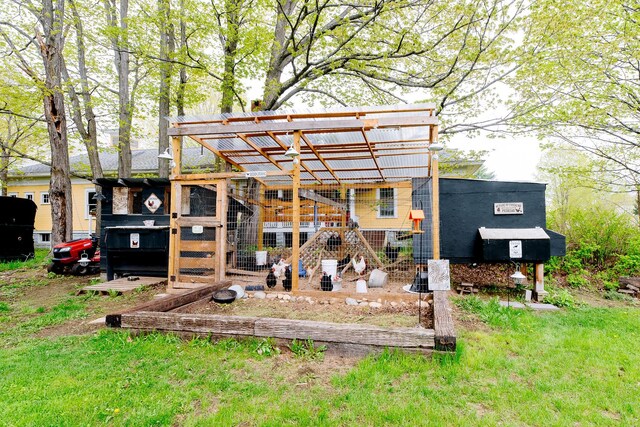22 Pleasant St, Phillips, ME 04966 - rear view of property with exterior structure and an outdoor structure