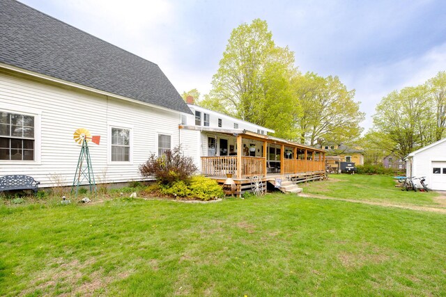 22 Pleasant St, Phillips, ME 04966 - back of property featuring a yard, a wooden deck, and a shingled roof
