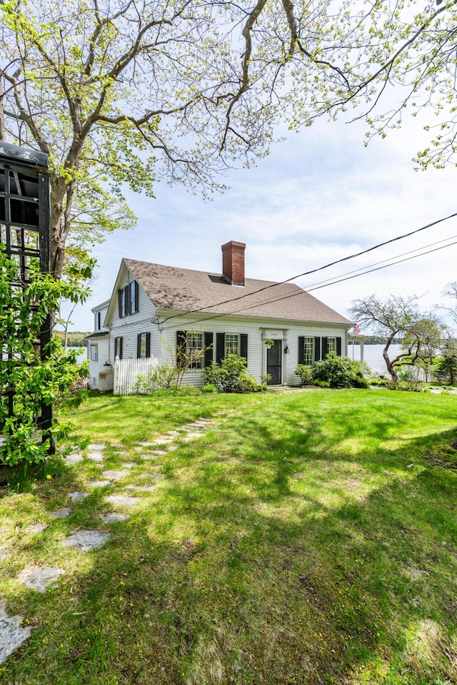 rear view of property with a chimney