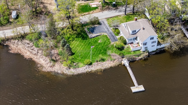 aerial view of property and surrounding area featuring a nearby body of water