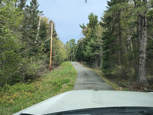 view of street featuring a view of trees