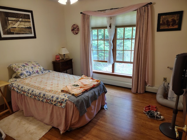 bedroom with wood finished floors
