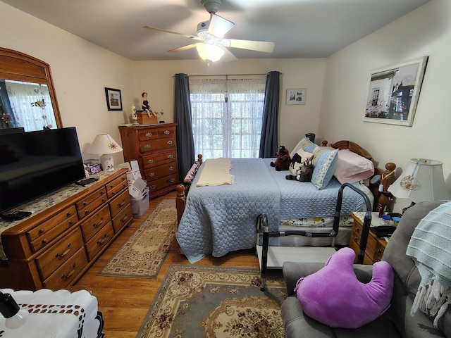 bedroom featuring wood finished floors and a ceiling fan