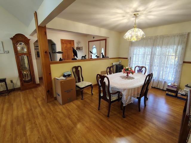 dining room featuring a chandelier and wood finished floors