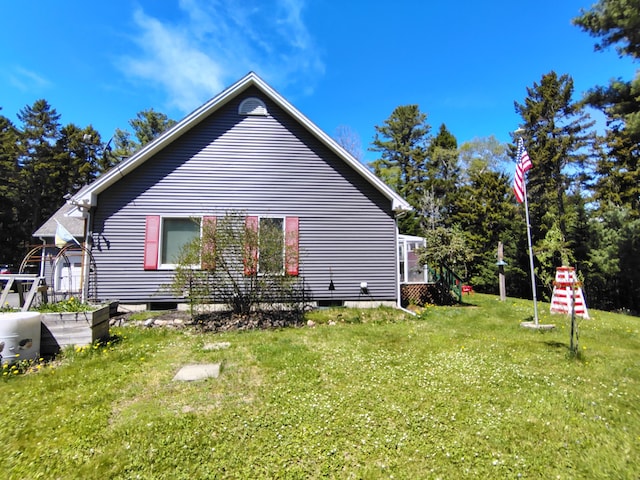 rear view of house with a lawn