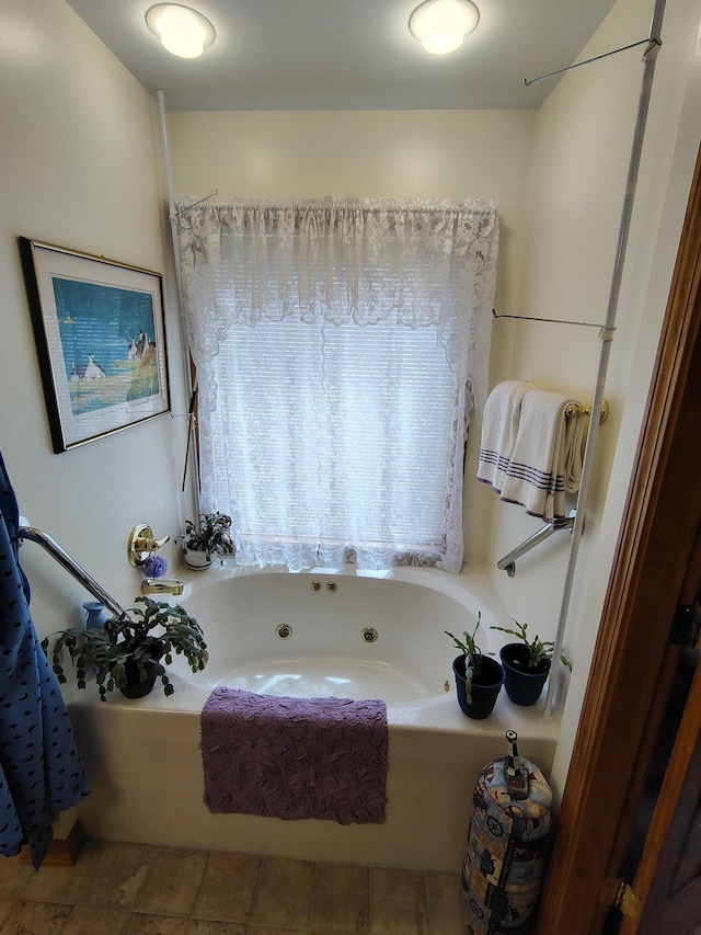 bathroom with a whirlpool tub