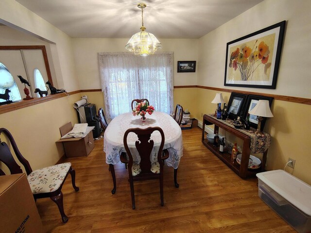 100 Weber Ln, Calais, ME 04619 - dining room featuring a chandelier and wood finished floors