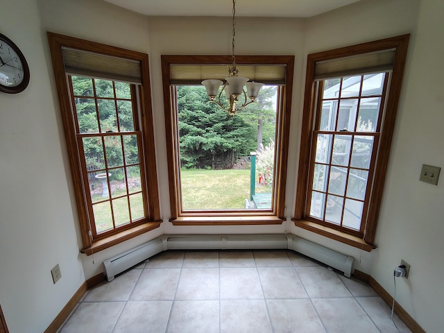 100 Weber Ln, Calais, ME 04619 - unfurnished dining area with a chandelier, light tile patterned floors, and a baseboard heating unit