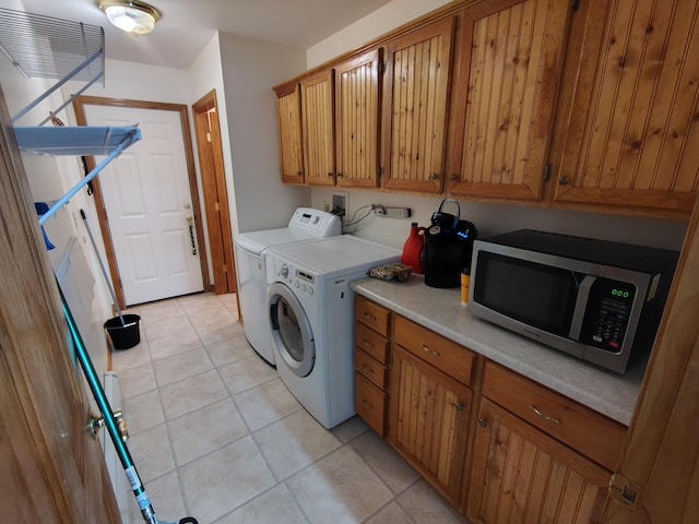 100 Weber Ln, Calais, ME 04619 - washroom featuring light tile patterned flooring, washer and clothes dryer, and cabinet space