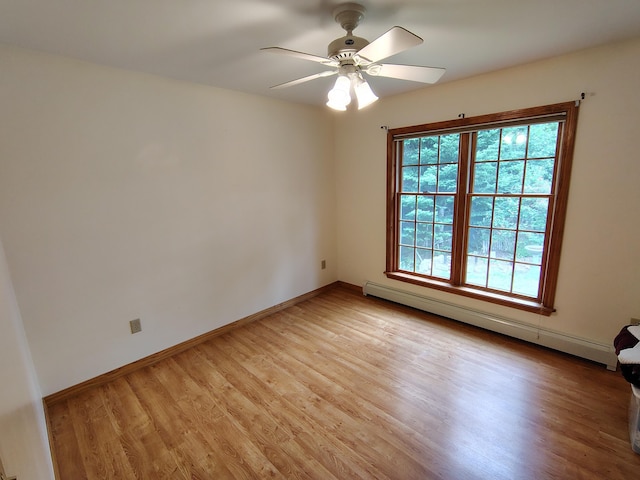 100 Weber Ln, Calais, ME 04619 - unfurnished room featuring baseboard heating, light wood finished floors, and a ceiling fan