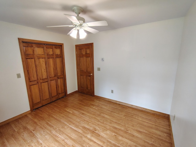 100 Weber Ln, Calais, ME 04619 - unfurnished bedroom with light wood-style flooring, a closet, and ceiling fan