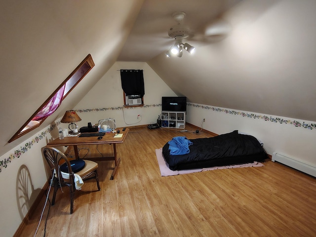 100 Weber Ln, Calais, ME 04619 - bedroom with wood finished floors, vaulted ceiling, and baseboard heating