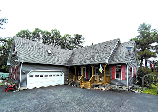100 Weber Ln, Calais, ME 04619 - view of front of home with covered porch, driveway, and a garage
