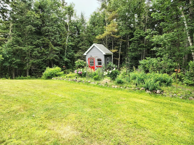 100 Weber Ln, Calais, ME 04619 - view of grassy yard featuring an outbuilding and a view of trees