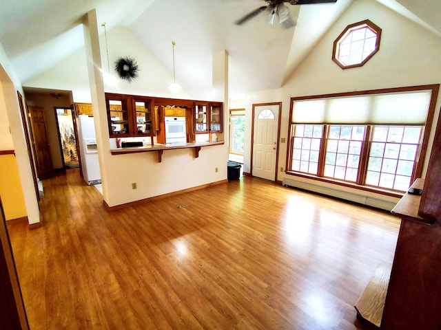 100 Weber Ln, Calais, ME 04619 - unfurnished living room featuring high vaulted ceiling, a ceiling fan, a baseboard radiator, and wood finished floors
