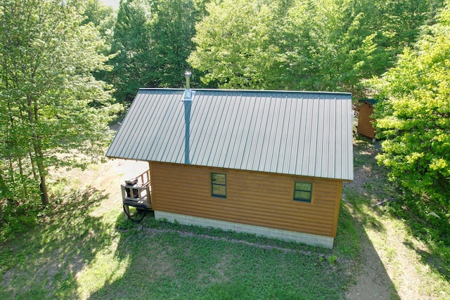 233 Weld Rd, Phillips, ME 04966 - view from above of property with a heavily wooded area