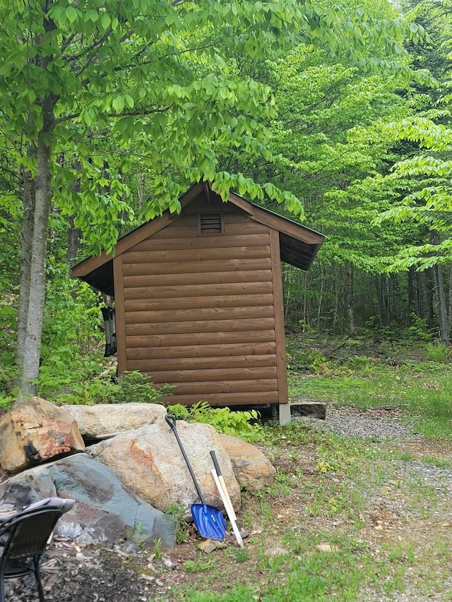233 Weld Rd, Phillips, ME 04966 - view of shed featuring a forest view
