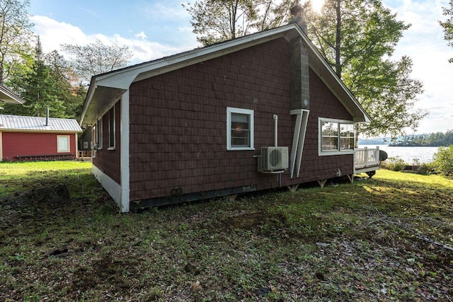 567 Phinney Farm Rd, Lincoln, ME 04457 - view of home's exterior with a cooling unit and a water view
