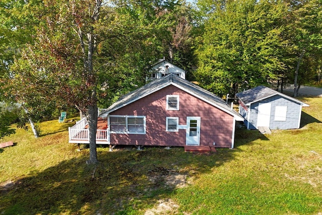 567 Phinney Farm Rd, Lincoln, ME 04457 - back of property featuring a deck and a lawn