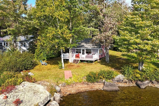 567 Phinney Farm Rd, Lincoln, ME 04457 - view of front facade featuring a wooden deck and a front lawn