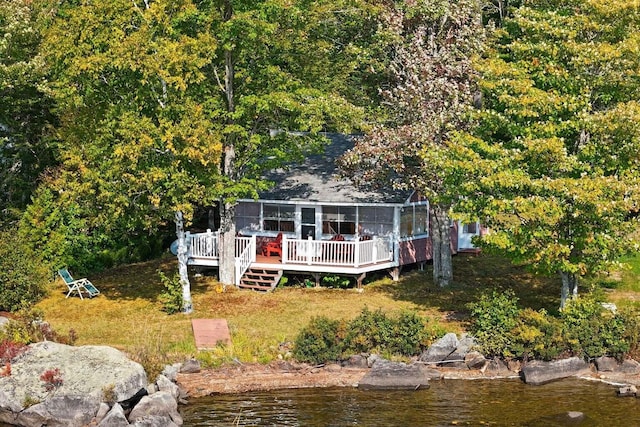 567 Phinney Farm Rd, Lincoln, ME 04457 - back of house with a deck with water view and a sunroom
