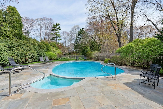 7 Clubhouse Dr, Kennebunk, ME 04043 - view of swimming pool with a fenced backyard, a patio, view of wooded area, and a pool with connected hot tub