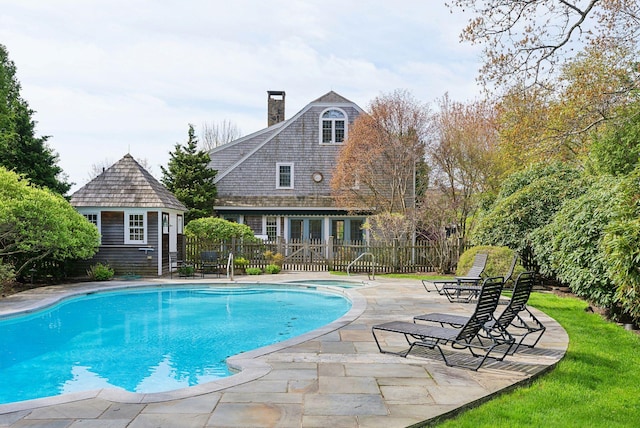 7 Clubhouse Dr, Kennebunk, ME 04043 - view of swimming pool featuring fence, a patio, and an outbuilding