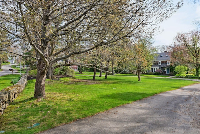 7 Clubhouse Dr, Kennebunk, ME 04043 - surrounding community with a lawn