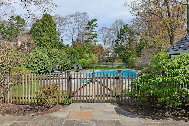 7 Clubhouse Dr, Kennebunk, ME 04043 - gate featuring fence and view of wooded area
