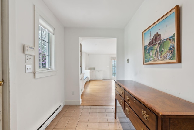7 Clubhouse Dr, Kennebunk, ME 04043 - corridor with light tile patterned flooring, a baseboard radiator, and baseboards