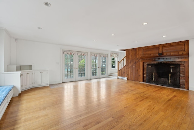 7 Clubhouse Dr, Kennebunk, ME 04043 - unfurnished living room featuring stairs, light wood-style flooring, recessed lighting, a brick fireplace, and baseboard heating