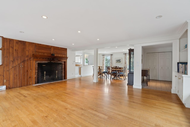 7 Clubhouse Dr, Kennebunk, ME 04043 - unfurnished living room featuring light wood-style floors, a fireplace, recessed lighting, and a baseboard radiator