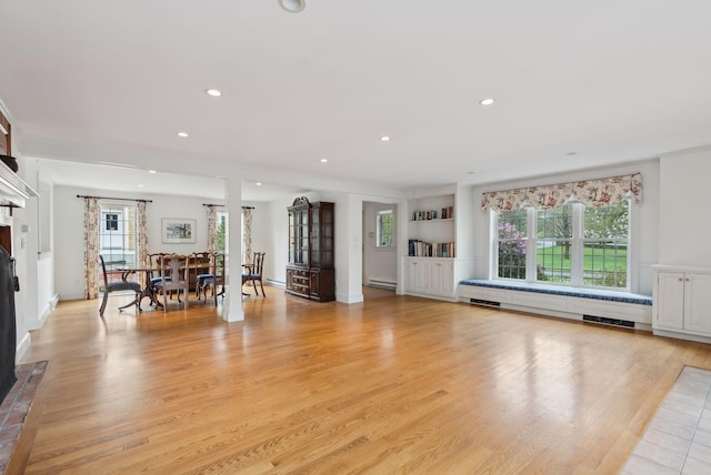 7 Clubhouse Dr, Kennebunk, ME 04043 - living area featuring a glass covered fireplace, recessed lighting, light wood-style flooring, and a baseboard radiator
