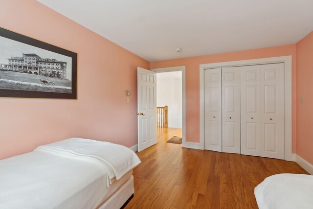 7 Clubhouse Dr, Kennebunk, ME 04043 - bedroom with wood finished floors, baseboards, and a closet