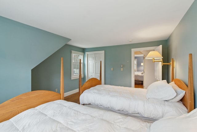7 Clubhouse Dr, Kennebunk, ME 04043 - bedroom featuring a closet, wood finished floors, and baseboards