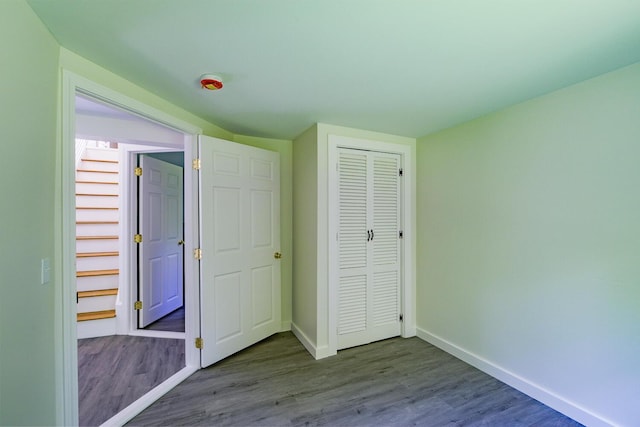 204 Weymouth Rd, Morrill, ME 04952 - unfurnished bedroom with baseboards, wood finished floors, and a closet