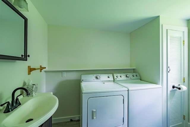 204 Weymouth Rd, Morrill, ME 04952 - laundry area featuring washer and clothes dryer, cabinet space, baseboards, and wood finished floors
