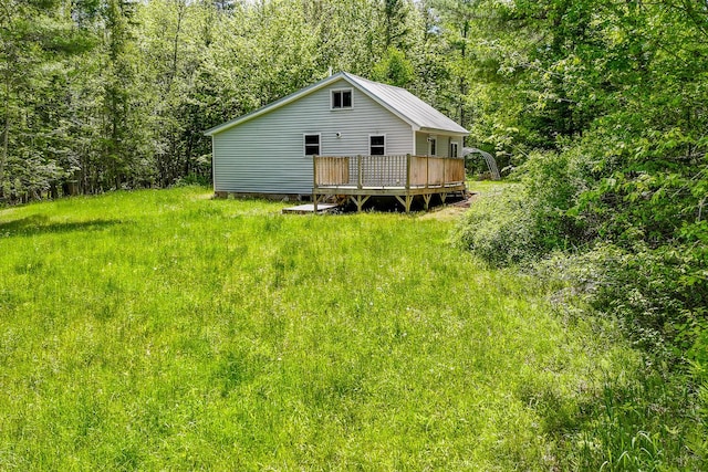 204 Weymouth Rd, Morrill, ME 04952 - rear view of house with a wooden deck and a view of trees