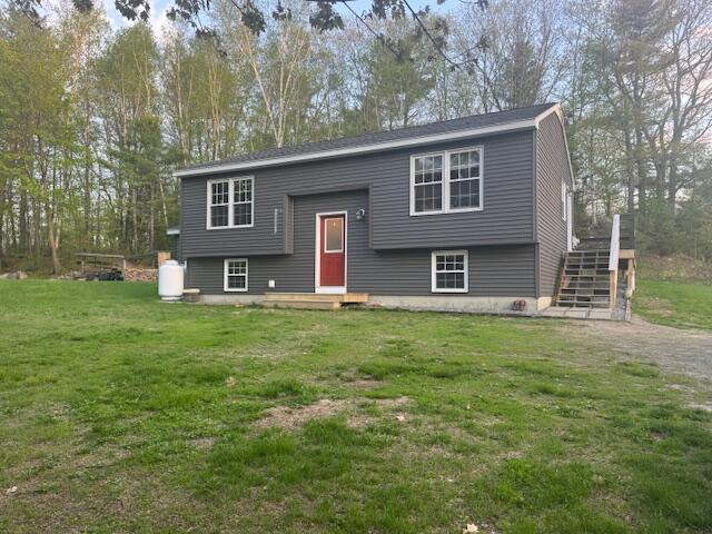 20 Oak Ridge Dr, Chelsea, ME 04330 - bi-level home featuring a front yard and stairway