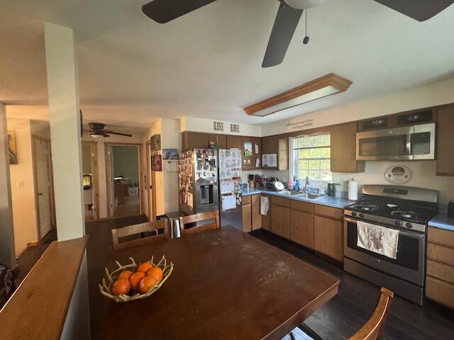 20 Oak Ridge Dr, Chelsea, ME 04330 - kitchen featuring stainless steel appliances, ceiling fan, a sink, and glass insert cabinets
