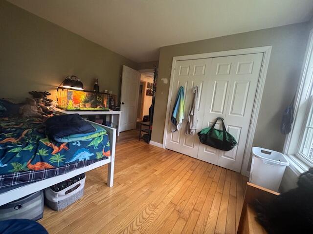 20 Oak Ridge Dr, Chelsea, ME 04330 - bedroom with wood finished floors and a closet